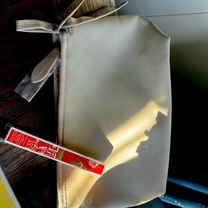 Burberry bag and Coach Poppy Blossom rollerball parfum